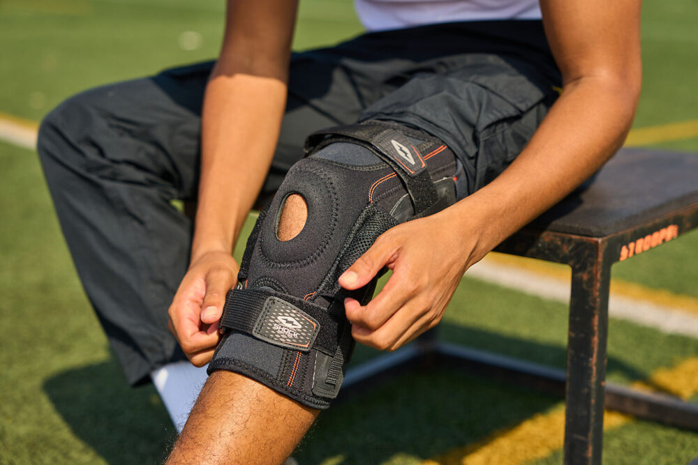 875-BK_Ultra Knee Support With Bilateral Hinges Black_Lifestyle 3.jpg